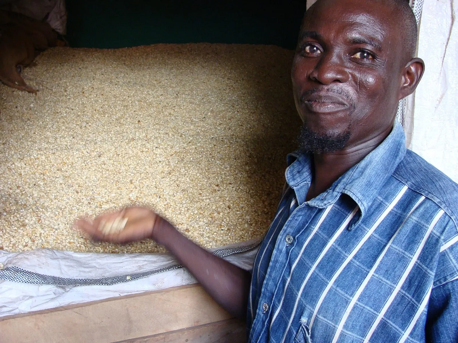 An agribusiness owner running tractor services outside Tamale, with his grain