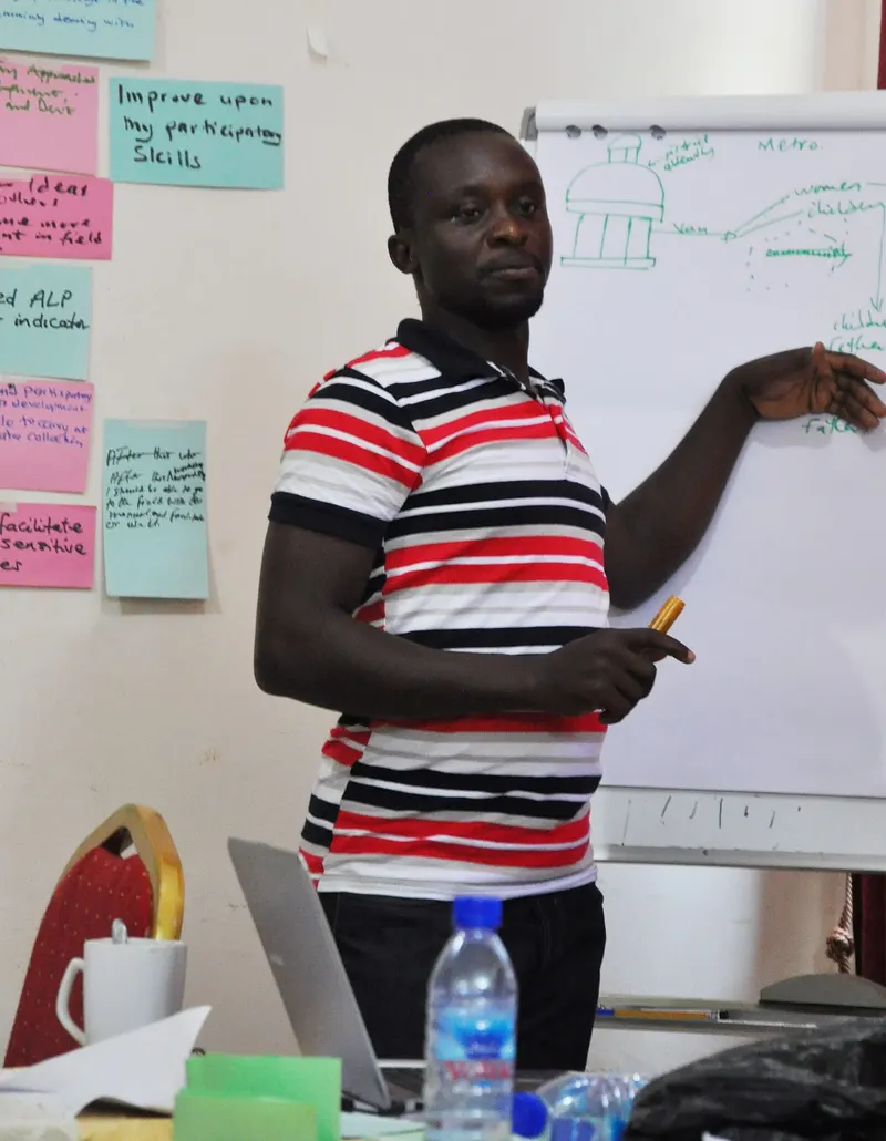 A facilitator presenting at a participatory planning workshop