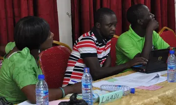 Participants working through a planning exercise around a workshop table